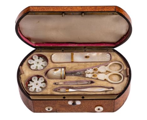 An early 19th Century burr maple and inlaid musical etui: the shallow domed hinged lid inlaid with mother-of-pearl lyre medal
