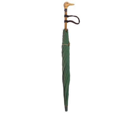 A late Victorian parasol with carved ivory duck head automaton handle:, the push-button action causing the duck's beak to ope