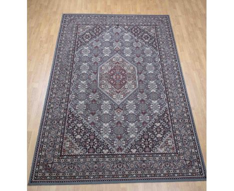 Persian carpet. Protect wool. Color: blue/red. Floral decor. Dimensions: 286 x 203 cm. In good condition.