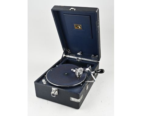 Antique His Masters Voice pathephone with approximately 20 playing records. With beautiful chrome work. Dimensions: 16 x 41 x