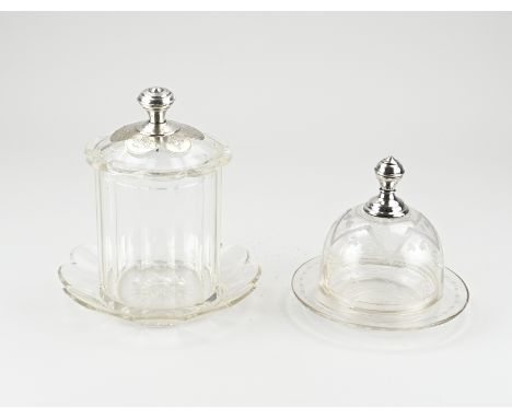 A crystal biscuit tin and a butter dish with silver. 833/000. A biscuit tin with saucer and a lid with a scalloped edge. The 
