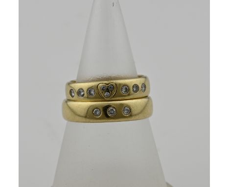 Two yellow gold wedding rings, 585/000, with diamond. A wedding ring set with 3 brilliant cut diamonds next to each other in 