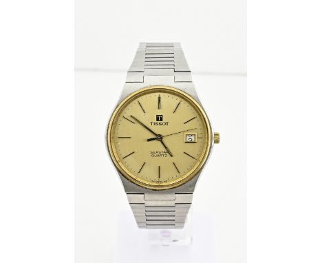Vintage Tissot watch, Seastar, quartz, unisex. Round gold-coloured case with a gold-coloured dial with date display. The stra
