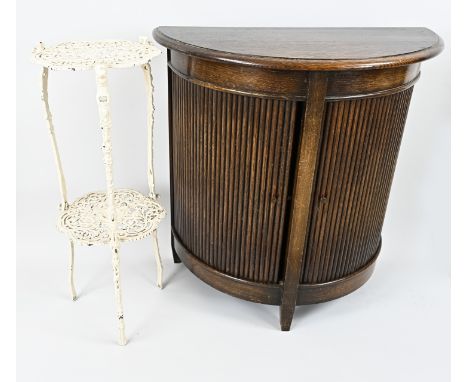 19th century oak half-moon cupboard with roller shutter, and a cast-iron etagere side table. Circa 1880. Dimensions: 27 x 67 