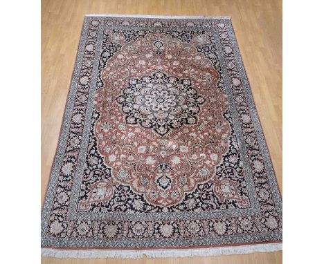 Hand-knotted Persian carpet. Light in color. Floral decor with a medallion in the middle. Dimensions: 312 x 217 cm. In good c