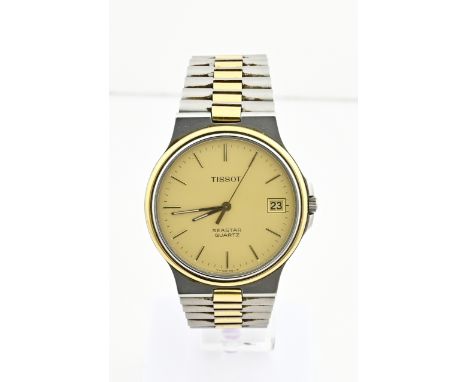 Vintage Tissot seastar watch, unisex, bicolour with a gold-coloured dial with a date display. The watch has a bicolour strap 