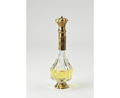 Fragrance flask with gold cap and foot, 585/000. Cut crystal fragrance flacon placed on a contoured round gold base. And a wi