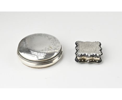 Two silver boxes, 833/000, a round box with engraving and gilding on the inside, presumably hosti box. Marked Topazio. Port P