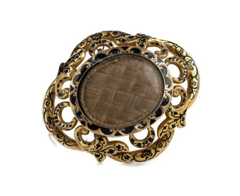 VICTORIAN MOURNING BROOCH, with central hairwork panel, openwork, sinuous mount decorated with black enamel, further glazed p