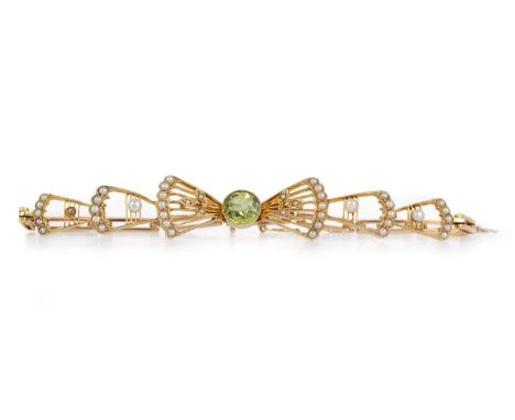 EDWARDIAN PERIDOT AND SEED PEARL BRACELET, the fan shaped section set with a central peridot, flanked by further seed pearl s