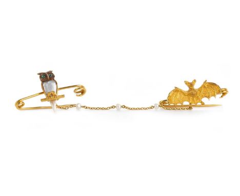 ZOOMORPHIC BAT AND OWL BROOCH, the owl with pearl body and gem set eyes, perched upon a branch, joined by a gold and pearl ch