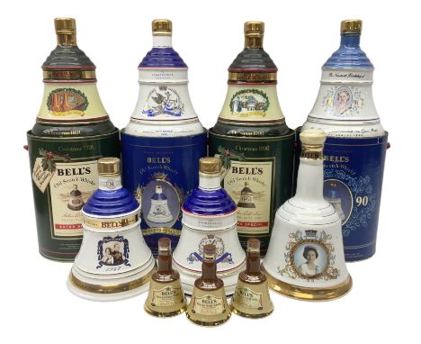 Bells, Scotch whisky, in seven Wade ceramic decanters, comprising two Christmas decanters 1990 and 1991, 60th birthday of Que