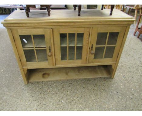 PINE FRAMED WALL MOUNTED CUPBOARD WITH THREE GLAZED DOORS WITH OPEN SHELF 