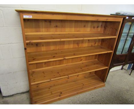 STAINED PINE FRAMED OPEN FRONTED THREE FIXED SHELF BOOKCASE WITH PANEL BACK