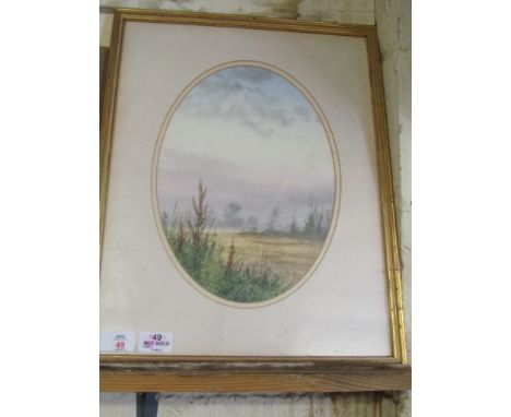 K WALTON OVAL FRAMED WATERCOLOUR OF A LANDSCAPE SCENE 