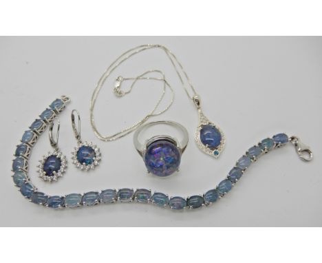 A suite of opal triplet pendant, ring earrings and bracelet Condition Report: Not available for this lot