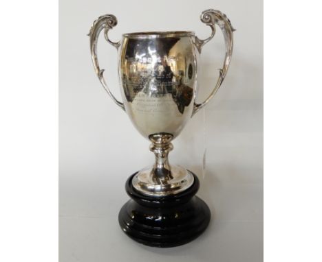 A silver golfing trophy cup "The Forrest Cup" the golf club of the Edinburgh Business Club engraved with a list of winners 19