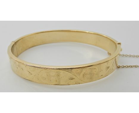 A rolled gold bangle, weight 15gms Condition Report: Available upon request