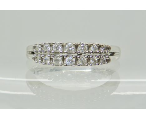 A 14ct gold double row eternity ring, set with estimated approx 0.25cts, finger size N1/2, weight 3.4gms Condition Report: Li