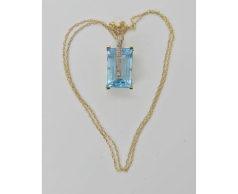 A 9ct gold blue topaz and diamond pendant and chain, length of pendant 2.5cm, length of chain 44cm, weight 5.7gms Condition R