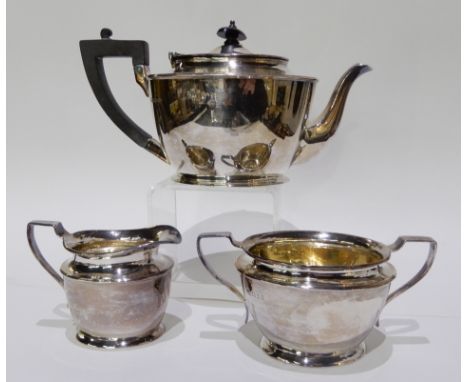 A three piece silver tea service by Pairpoint Brothers, London 1928, 952gms Condition Report: Available upon request