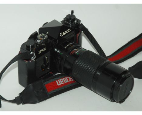 A Canon F-1 camera and accessories and Olympus camera Condition Report: Available upon request