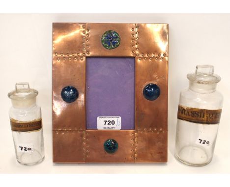 A copper frame with enamel roundels, 22cm x 18cm and two chemists bottles (3) Condition Report: Available upon request
