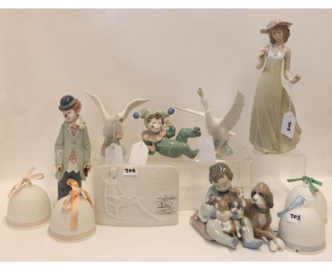 A collection of Lladro including a figure of a boy with dog and puppies, a clown, four bells, plaque and two geese together w