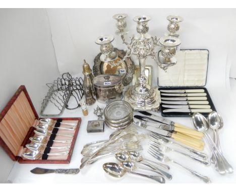 A tray lot of EP - candelabrum, tea caddy, toastracks, loose cutlery etc Condition Report: Available upon request