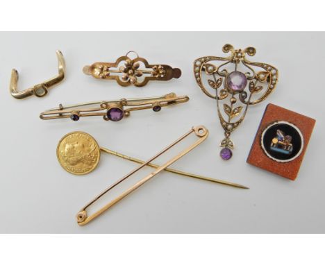 A 9ct gold Edwardian pendant brooch, length 4cm, two 9ct gold brooches, a 9ct gold part Omega watch buckle, a 1903 gold Centi