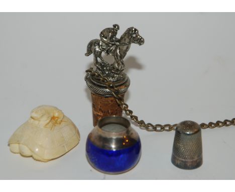 A carved frog netsuke, white-metal bottle stopper formed as a horse and rider etc Condition Report: Available upon request