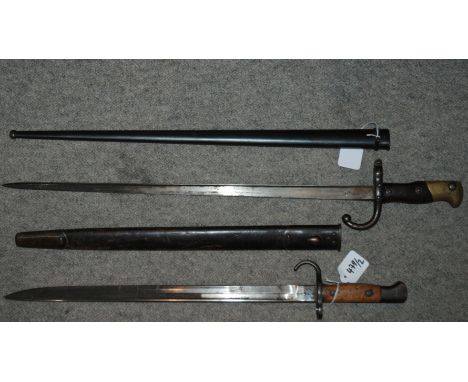 A French bayonet in metal scabbard with inscribed blade and another bayonet in leather scabbard (2) Condition Report: Availab