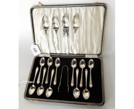 A lot comprising a cased part set of eleven coffee spoons with tongs, Birmingham 1930 and a silver grapefruit spoon, Sheffiel