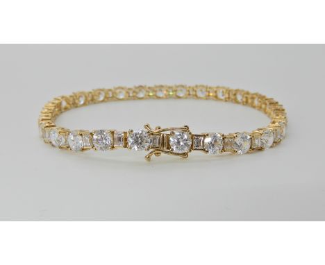 A 14k gold cubic zirconia line bracelet, by QVC, length 18.5cm, weight 13gms Condition Report: Light general wear.