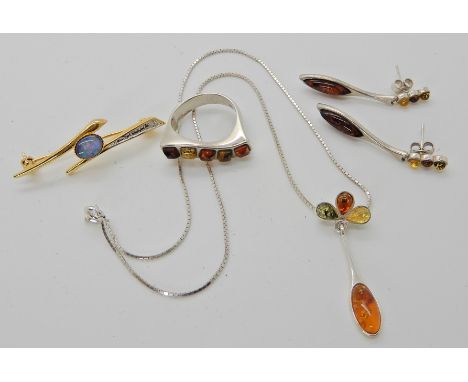 A collection of silver amber jewellery and a gold plated opal triplet brooch Condition Report: Not available for this lot