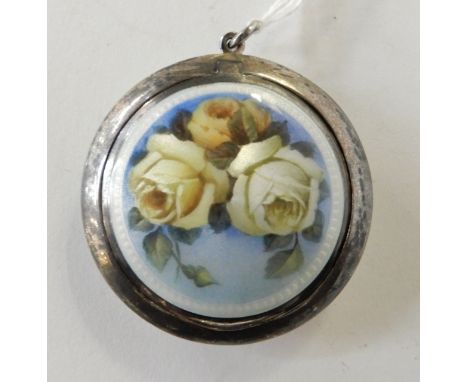 A continental silver compact, marked 925, of circular form, the hinged cover decorated in floral enamel, 5.3cm diameter Condi