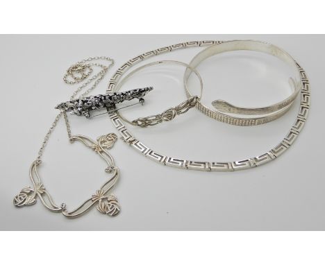 A white metal snake bangle, silver Mackintosh bangle, Greek key pattern necklace and other items Condition Report: Not availa