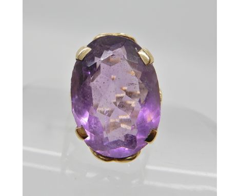 A yellow metal amethyst set ring, amethyst approx 17.7mm x 12.7mm, size J1/2, weight 4.7gms Condition Report: Available upon 