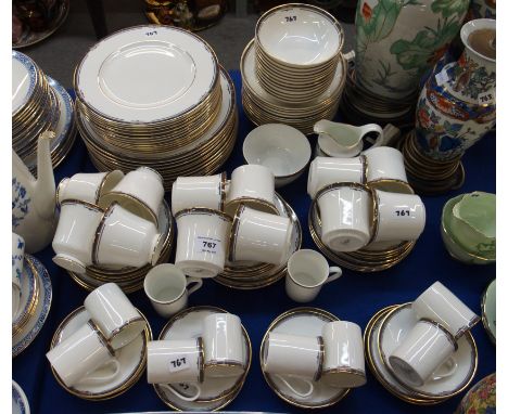 A Royal Doulton Musicale dinner service comprising twelve 27cm plates, twelve 22.5cm plates, twelve soup bowls, pudding bowls