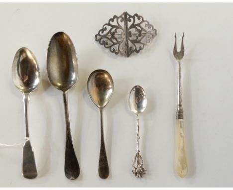 A lot comprising three assorted silver dessert spoons, a silver and mother of pearl pickle fork, a fancy teaspoon and a silve