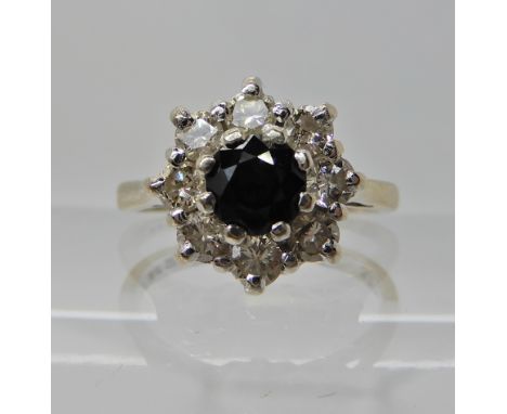 An 18ct white gold sapphire and diamond ring diamond content estimated approx 0.50cts, finger size L1/2, weight 4.4gms Condit