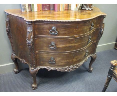 A Chippendale revival serpentine mahogany commode, with a gadroon moulded border and acanthus leaf and foliate scroll carved 