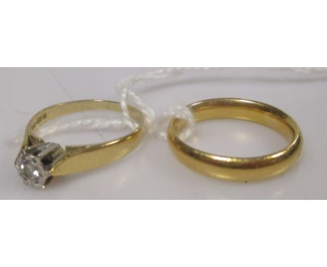 A 22ct gold wedding ring, 5.4g, and an 18ct single stone diamond ring, 2g (2)  