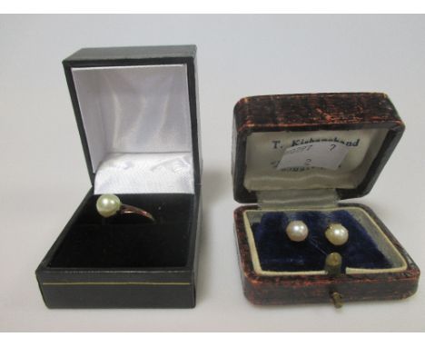 A pearl ring and a pair of pearl earstuds, both cased and assumed to be cultured pearls (2)  