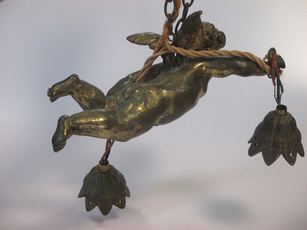 A gilt bronze flying Cupid ceiling light, early 20th century, with two ...