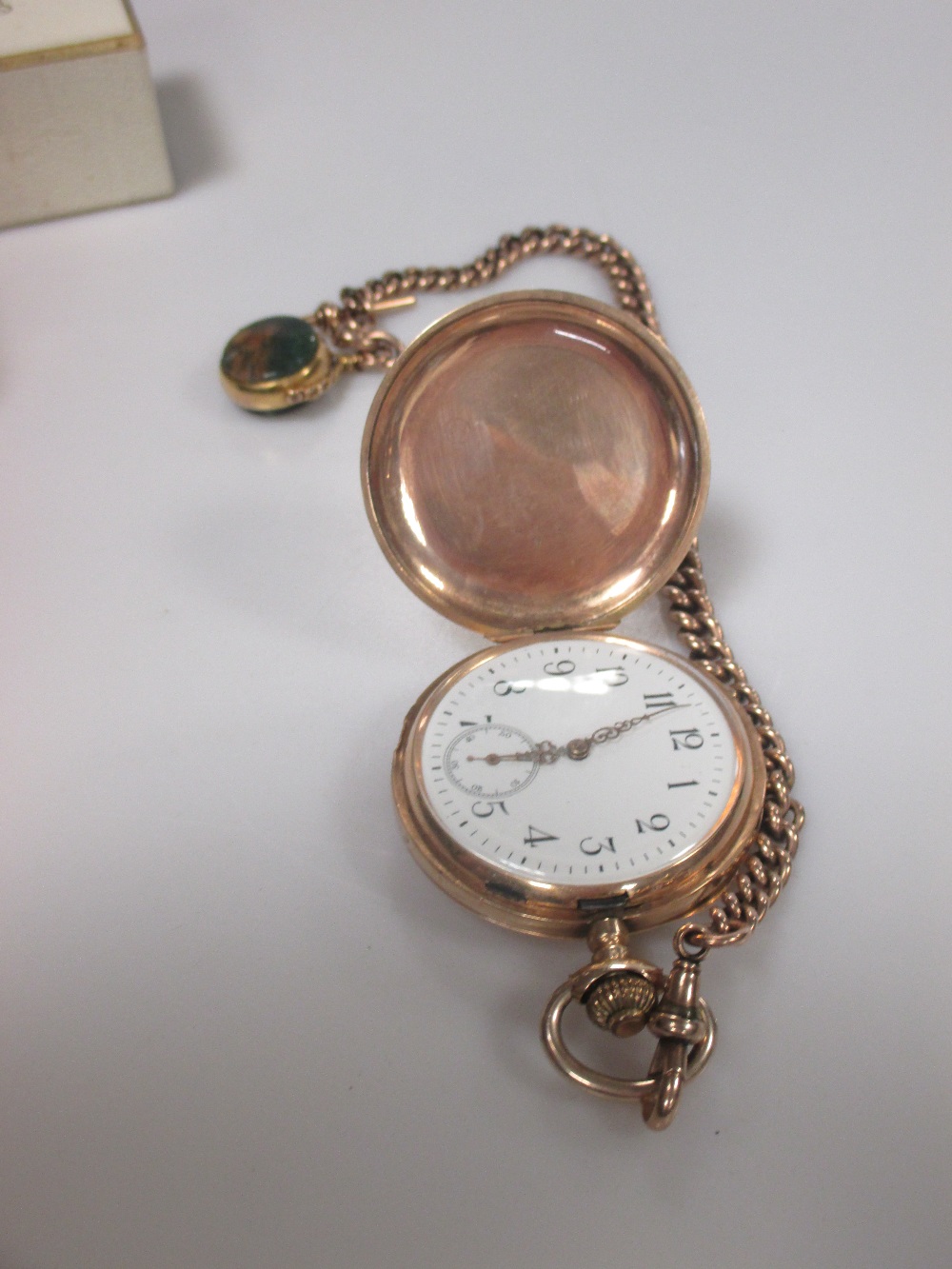 A 9ct gold pocket watch chain and fob and a 14ct gold pocket watch in