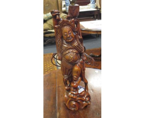 A carved Eastern hardwood figural lamp, (base 52cm high)  