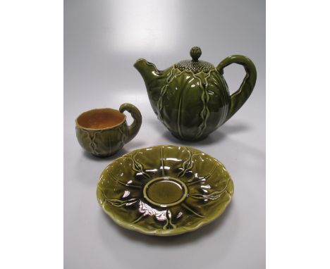 Linthorpe Pottery nos. 1365-1368 cabbage ware part teaset for four with teapot, some damages, and a terracotta pottery plaque