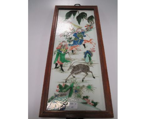 A painted ceramic panel, framed  