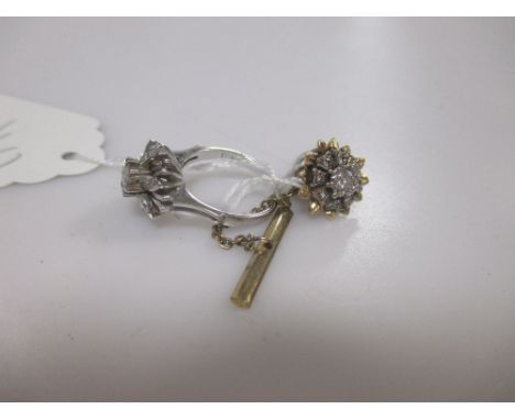 A diamond flowerhead cluster ring and a diamond flowerhead cluster pin (2)  